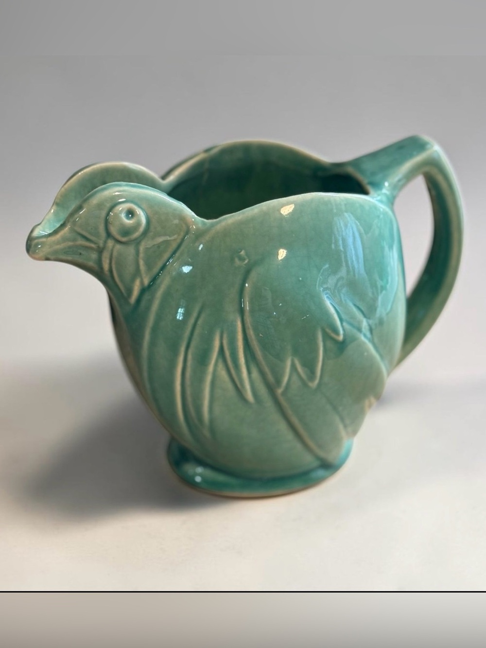 Vintage McCoy Pottery chicken pitcher from the 1940s and 1950s.